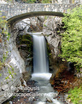 Christine Falls. Mt. Rainier, Washington. A smooth curtain of water flows over Christine Falls under the road to Paradise in Mt. Rainier National Park.  Ben Babusis, Lightscape Gallery.